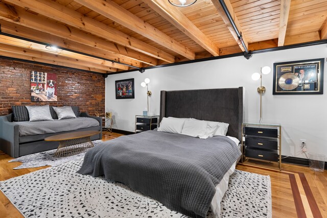 bedroom featuring brick wall, beam ceiling, light wood-type flooring, and wood ceiling