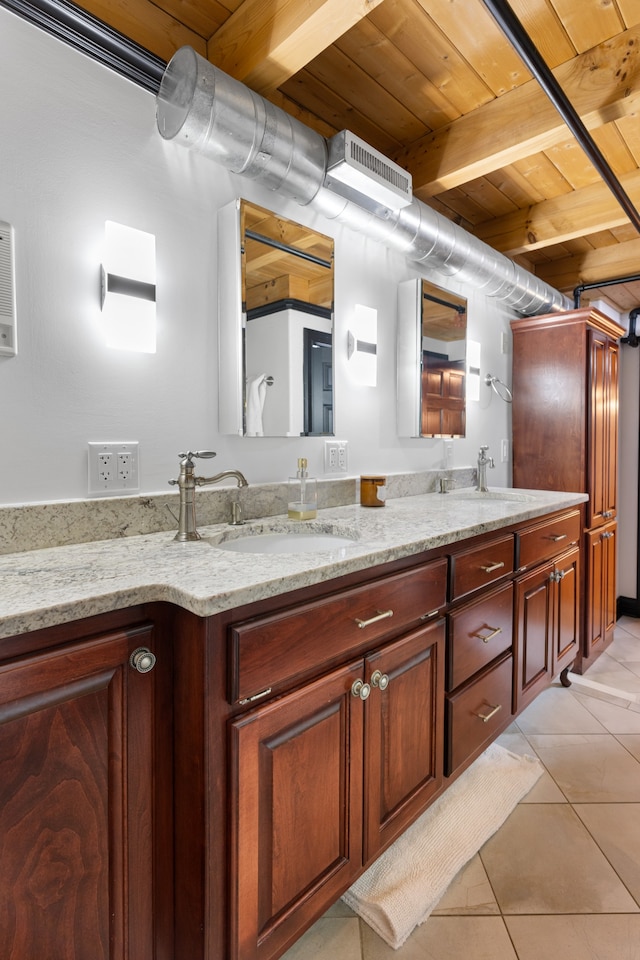 bathroom with tile patterned flooring, beamed ceiling, vanity, and wooden ceiling