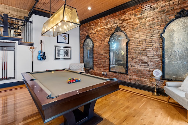 playroom with brick wall, wood ceiling, crown molding, hardwood / wood-style flooring, and pool table