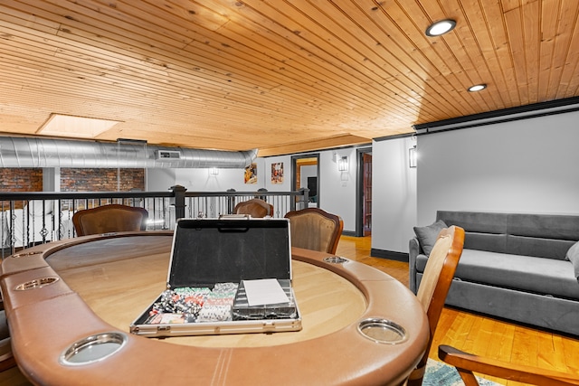 dining area with wooden ceiling and hardwood / wood-style flooring