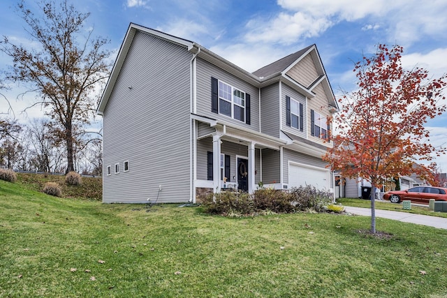 view of front of house with a garage and a front lawn