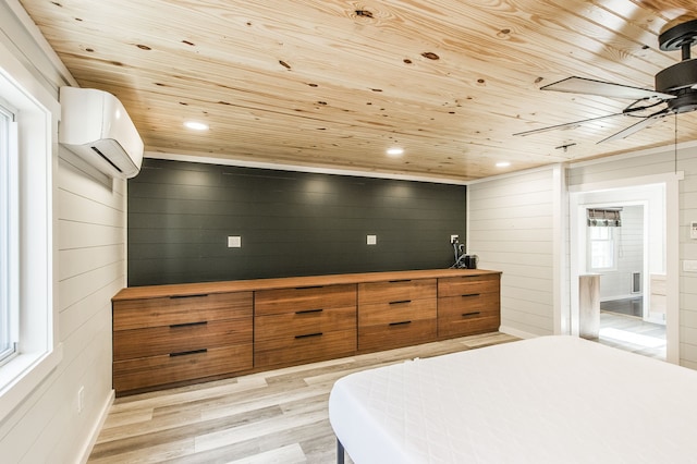 bedroom featuring a wall mounted AC, wooden walls, light hardwood / wood-style flooring, and wood ceiling