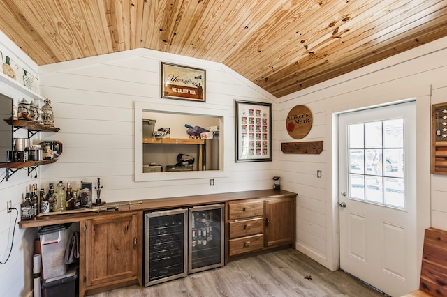 bar featuring wooden ceiling, wine cooler, wood walls, lofted ceiling, and light wood-type flooring