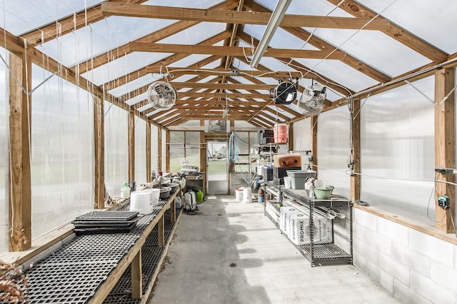 interior space featuring vaulted ceiling with beams