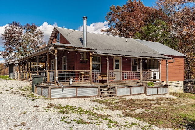 rear view of house with covered porch