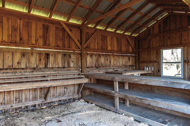 miscellaneous room with lofted ceiling