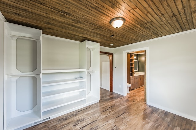 empty room with wooden ceiling, crown molding, and wood-type flooring