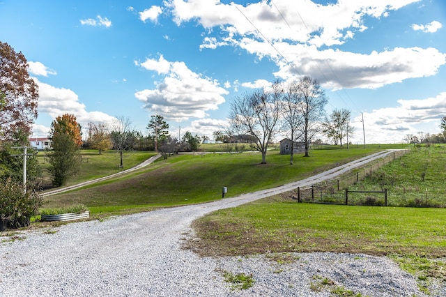 surrounding community with a lawn and a rural view