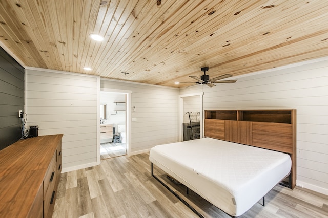 bedroom featuring ceiling fan, wood walls, light wood-type flooring, and wood ceiling