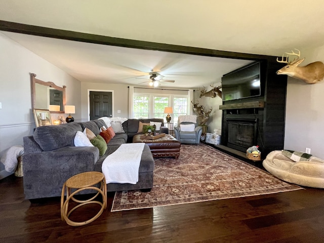 living room featuring hardwood / wood-style flooring and ceiling fan