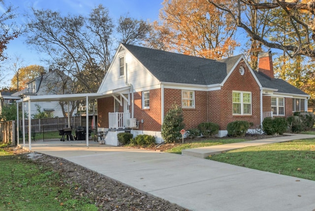 view of property exterior with a carport and a yard