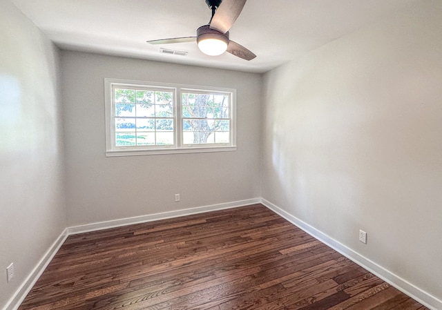 unfurnished room featuring dark hardwood / wood-style floors and ceiling fan