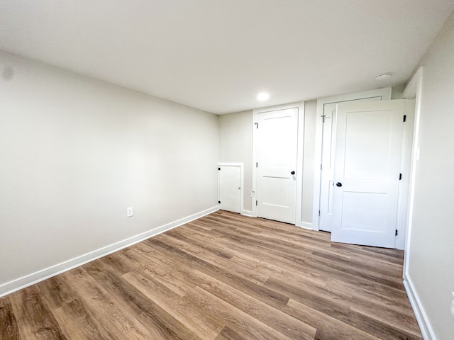 unfurnished room featuring wood-type flooring