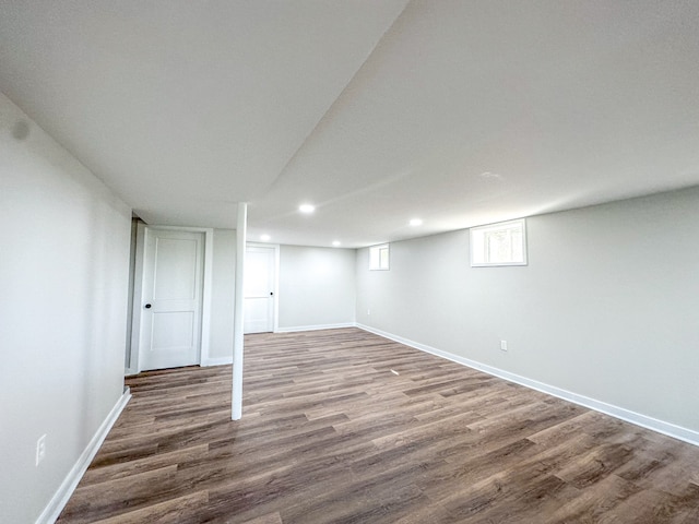 basement with hardwood / wood-style flooring