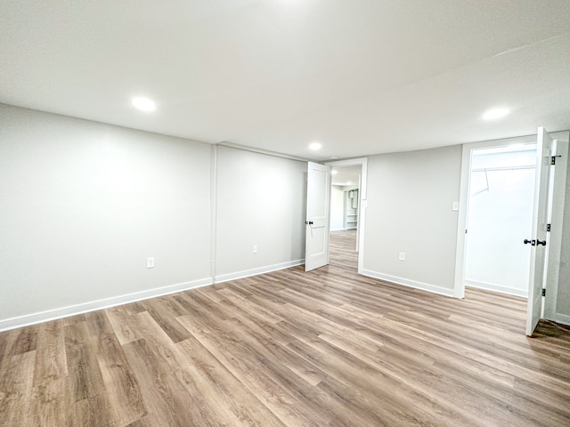 basement featuring light hardwood / wood-style flooring