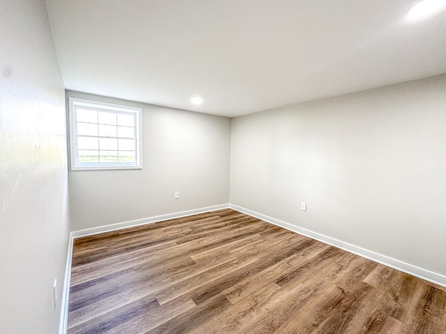 spare room with wood-type flooring