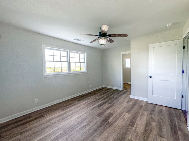 unfurnished bedroom with ceiling fan and hardwood / wood-style floors