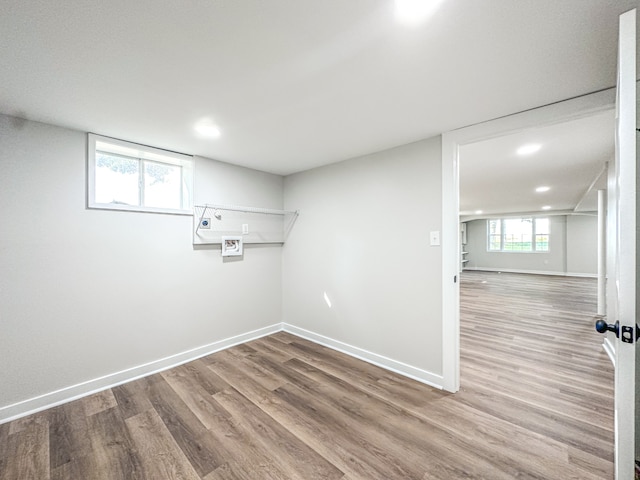 laundry area featuring light wood-type flooring