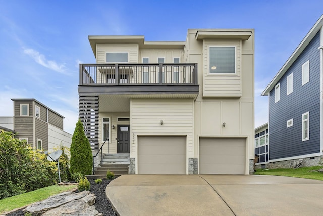 view of front of home featuring a balcony and a garage