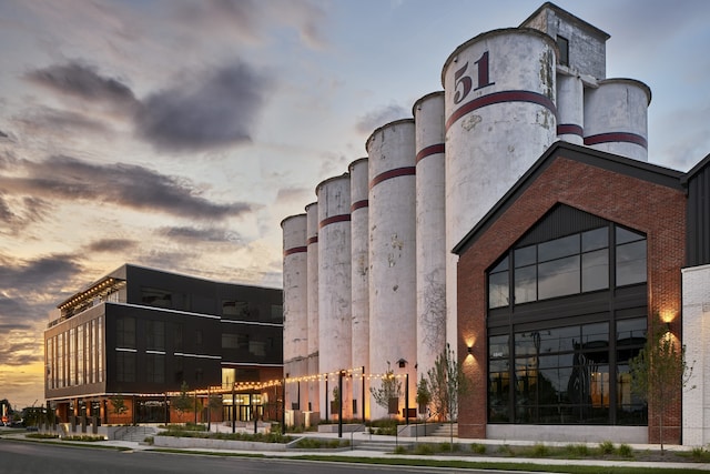 view of outdoor building at dusk