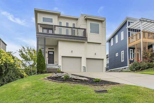 townhome / multi-family property featuring a front yard, a balcony, and a garage