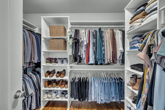 spacious closet featuring hardwood / wood-style floors