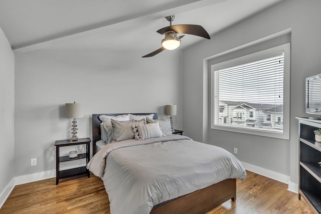 bedroom featuring hardwood / wood-style floors and ceiling fan