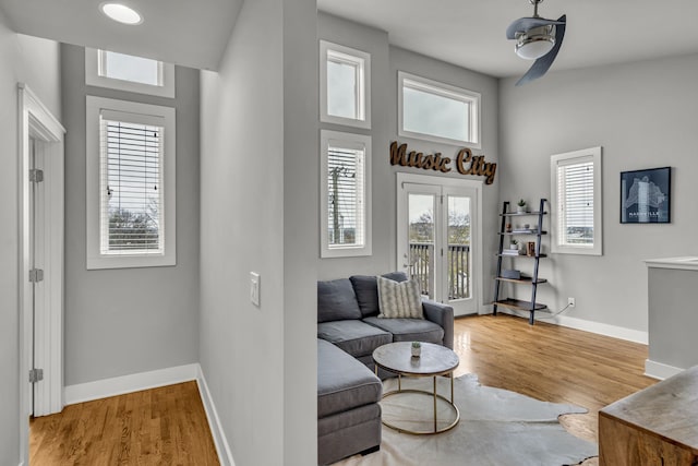 sitting room with light wood-type flooring and ceiling fan