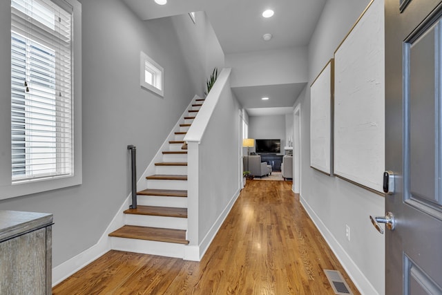 entryway with plenty of natural light and light hardwood / wood-style floors