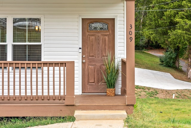 view of exterior entry with covered porch