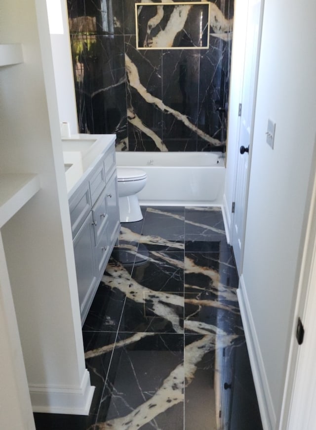 full bathroom featuring shower / tub combination, vanity, and toilet