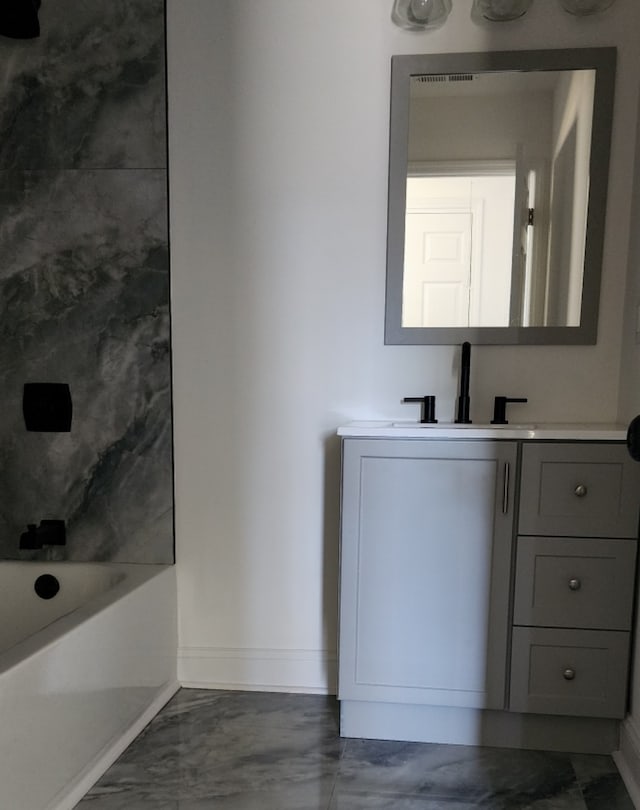 bathroom featuring vanity and shower / bath combination