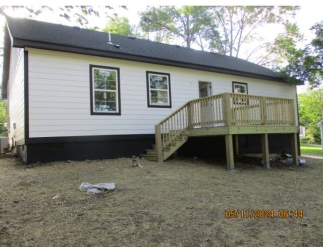 rear view of house featuring a deck