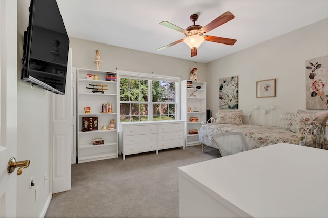 bedroom featuring ceiling fan and light carpet