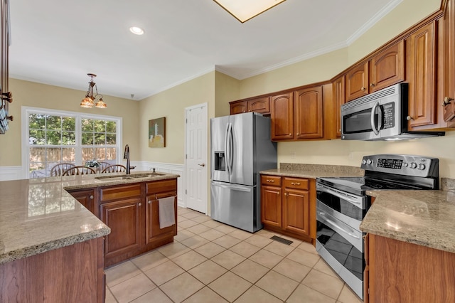 kitchen with an inviting chandelier, crown molding, sink, appliances with stainless steel finishes, and decorative light fixtures