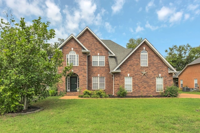 front facade with a front yard