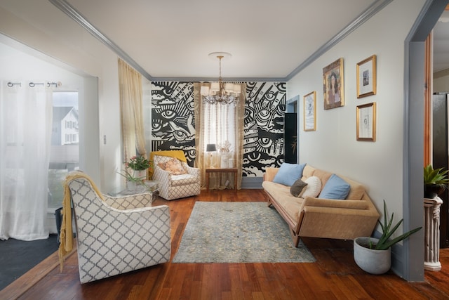 sitting room with dark hardwood / wood-style flooring, a chandelier, and ornamental molding