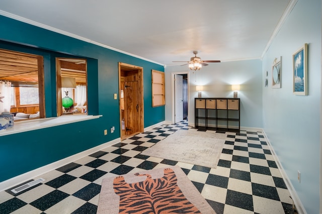 interior space with ceiling fan and ornamental molding