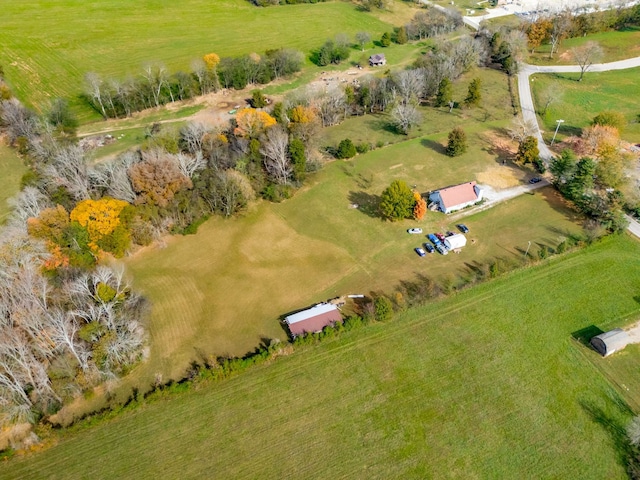 birds eye view of property with a rural view