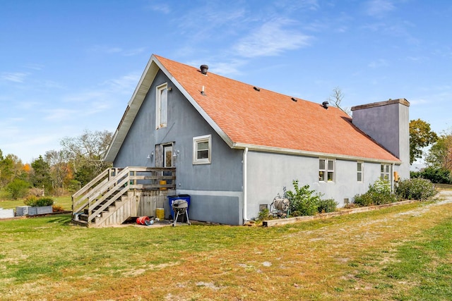 view of property exterior with a lawn