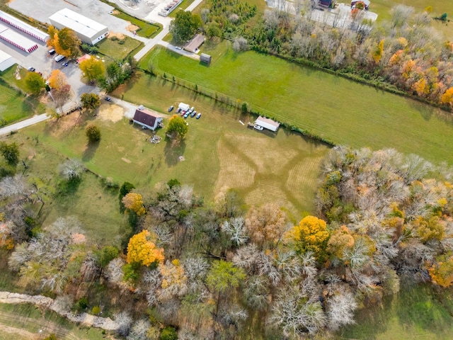 birds eye view of property with a rural view