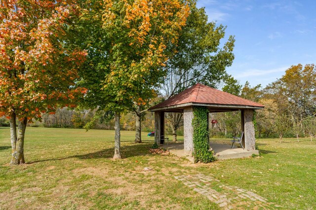 view of home's community with a gazebo and a lawn