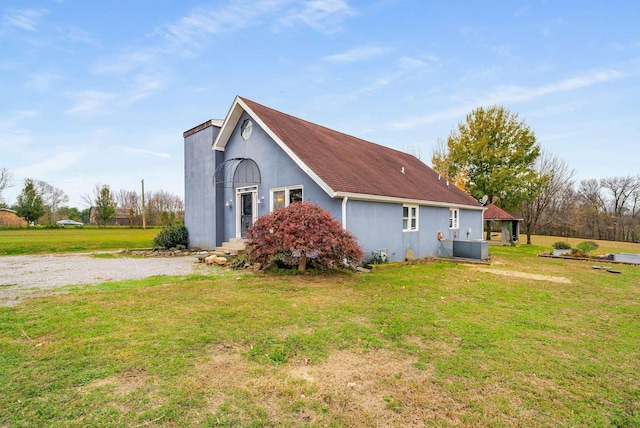 view of side of home featuring a yard