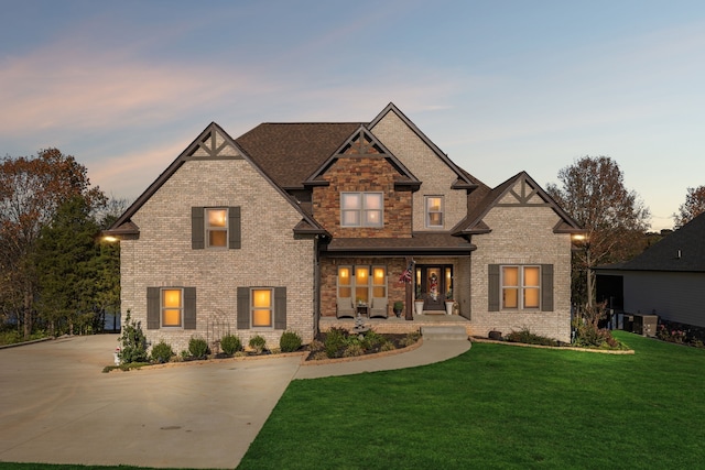 craftsman-style house featuring a yard and a porch