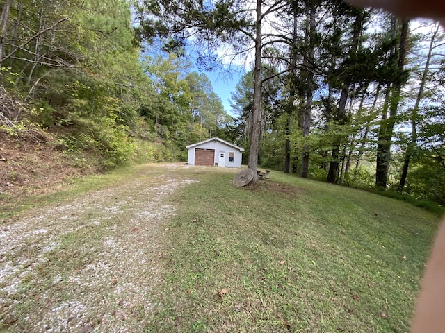 view of yard with an outbuilding and a garage