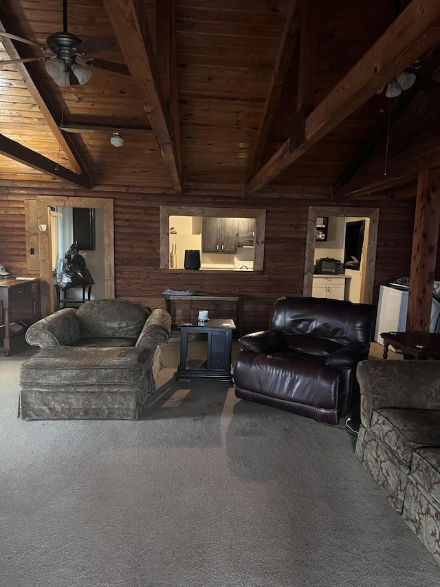 living room with carpet flooring, lofted ceiling with beams, ceiling fan, and wooden walls