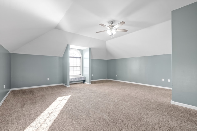 bonus room featuring ceiling fan, carpet, and vaulted ceiling