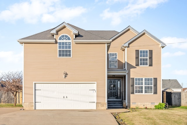 view of front of house featuring a front yard and a garage