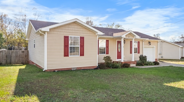 view of front of property with a garage and a front lawn