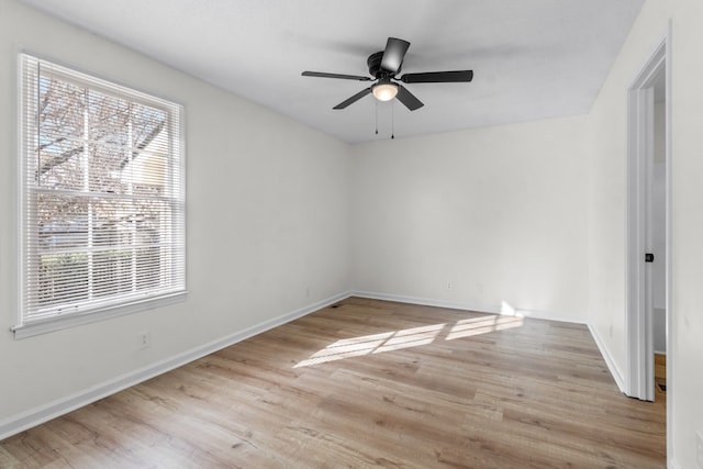 unfurnished room with ceiling fan and light wood-type flooring